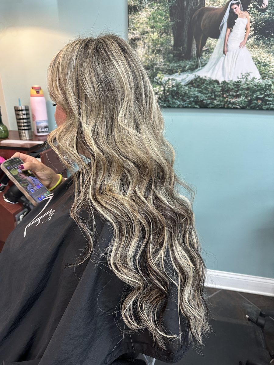 Seamless hair extensions adding length and volume with polished styling by Liberty Greenwood at K Bella Hair Studio & Spa in Brighton, MI - after transformation