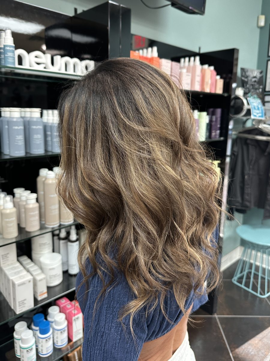 Dimensional highlights and lowlights with fresh root touch-up by Liberty Greenwood at K Bella Hair Studio & Spa in Brighton, MI