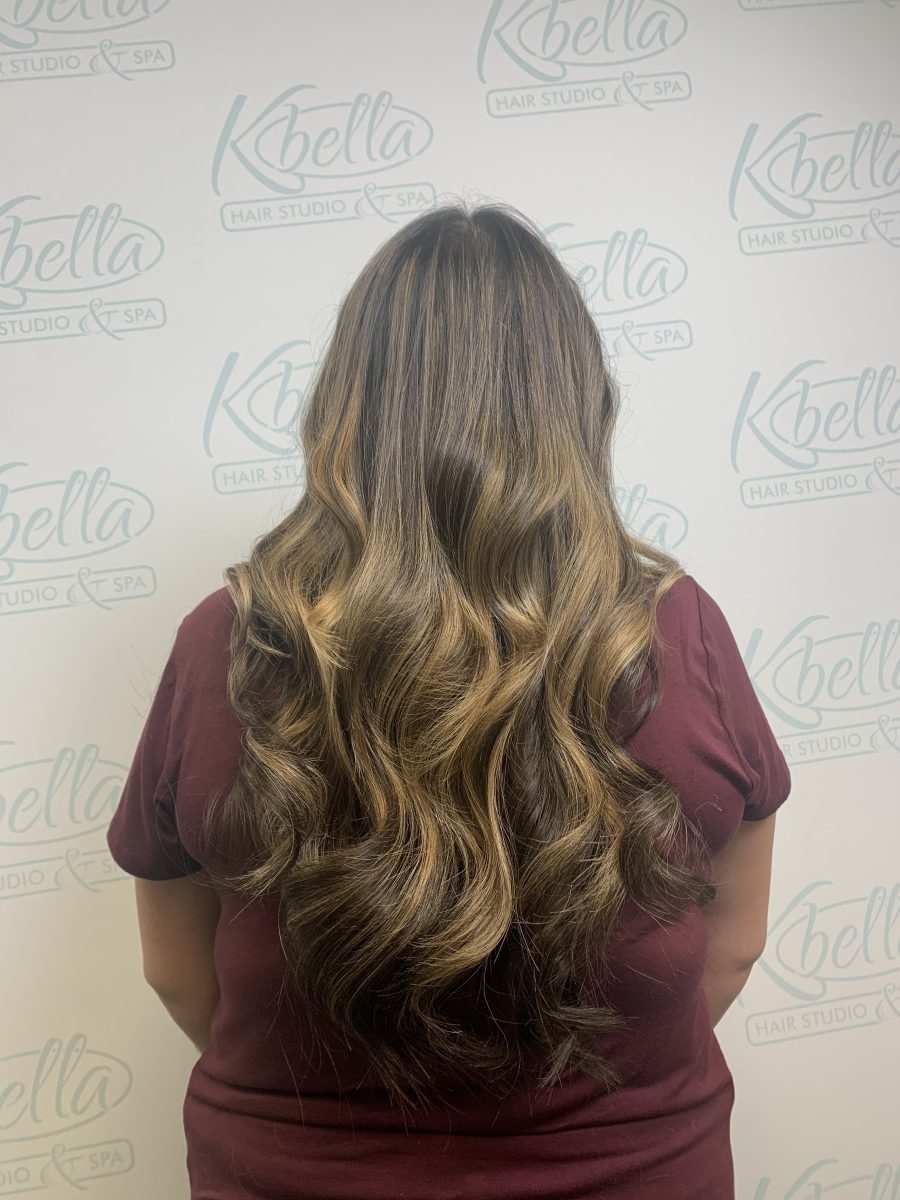 Seamless hair extensions adding length and volume by Brittney Holstege at K Bella Hair Studio in Brighton, MI