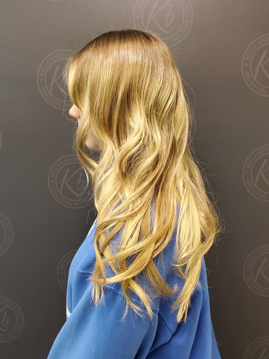 Sun-kissed balayage highlights by Siobhan Rozinski at K Bella Hair Studio in Brighton, MI
