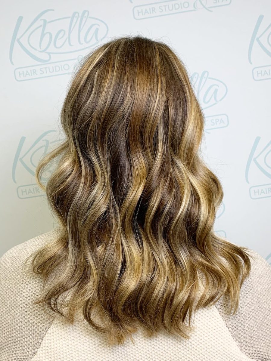 Sun-kissed balayage highlights by Brittney Holstege at K Bella Hair Studio in Brighton, MI