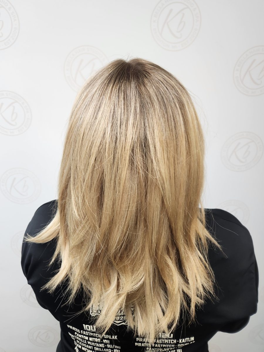 Sun-kissed balayage highlights with rich custom color by Siobhan Rozinski at K Bella Hair Studio in Brighton, MI
