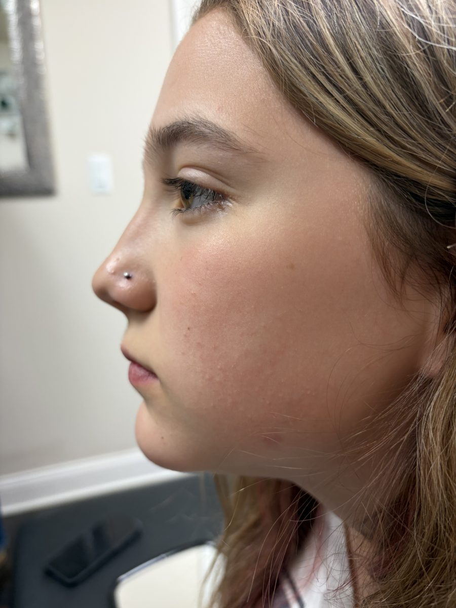 Ear piercing by K Bella by Paige Spence at K Bella Hair Studio & Spa in Brighton, MI
