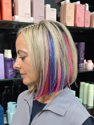 Seamless hair extensions adding length and volume with a fresh cut by Kristan Sayers at K Bella Hair Studio & Spa in Brighton, MI