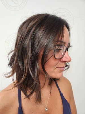 Dimensional highlights and lowlights with fresh root touch-up by Siobhan Rozinski at K Bella Hair Studio & Spa in Brighton, MI