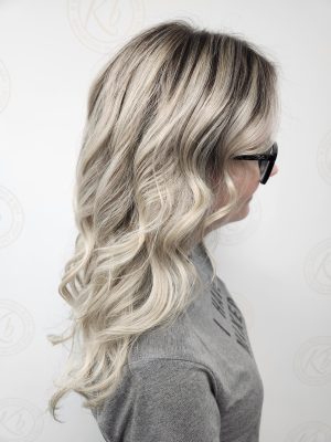 Sun-kissed balayage highlights with fresh root touch-up by Siobhan Rozinski at K Bella Hair Studio & Spa in Brighton, MI