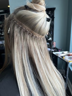 Seamless hair extensions adding length and volume by Liberty Greenwood at K Bella Hair Studio & Spa in Brighton, MI