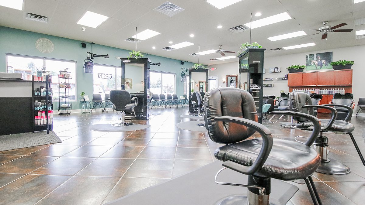 Styling chairs and retail shelves in the main K Bella salon